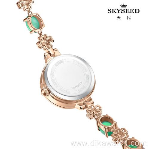 SKYSEED emerald type mother-of-pearl watch